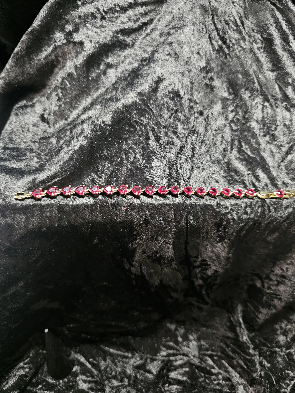 Gold-Plated Bracelet with Red Hearts Gemstones. Has a extender